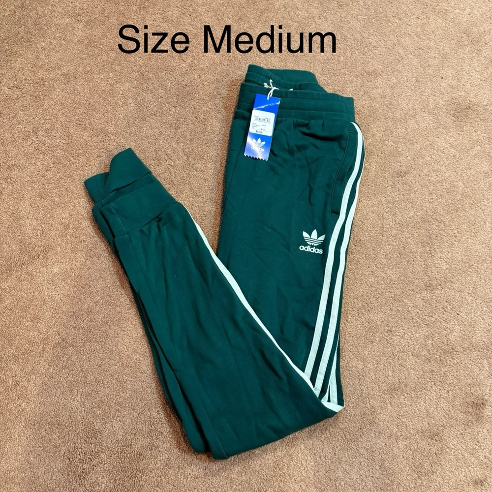 SOLD Adidas Women's Green Joggers with White Stripes